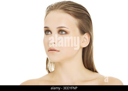 Attractive woman's portrait. Closeup. She's looking up. Isolated on white Stock Photo