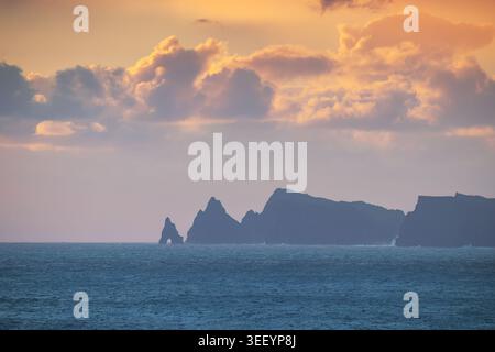 Dramatic Sea Cliffs Silhouette at Sunrise over the Atlantic Ocean Stock Photo