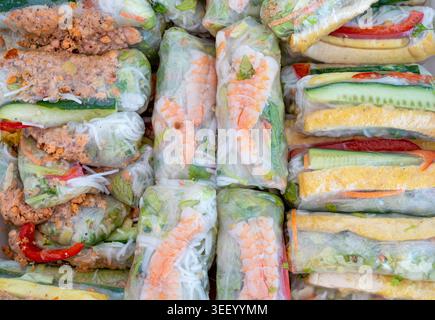 Spring rolls, Vietnamese summer rice rolls filled with shrimp, vegetables, herbs, and noodles, wrapped in translucent rice paper Stock Photo