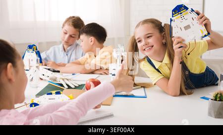Children Engaged in Creative Robotics Activity at a Bright Classroom in the Afternoon Stock Photo