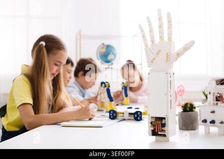 Children Engage in Creative Robotics Project in Bright Classroom Space Stock Photo