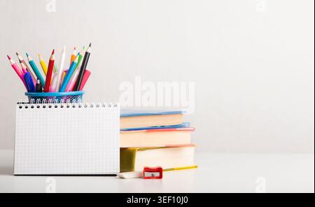 School and office supplies with books on white background Stock Photo