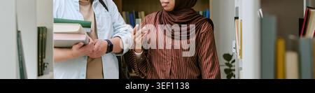 Multiethnic Students Studying in Library for Migrant Education Stock Photo