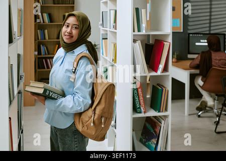 Portrait of Asian Young Student Studying in Library for Education Stock Photo