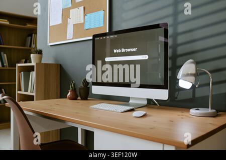 Home Office Workspace Featuring Desktop Computer for Online Learning Stock Photo