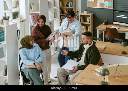 Diverse College Students Studying Together for Migrant Education Stock Photo