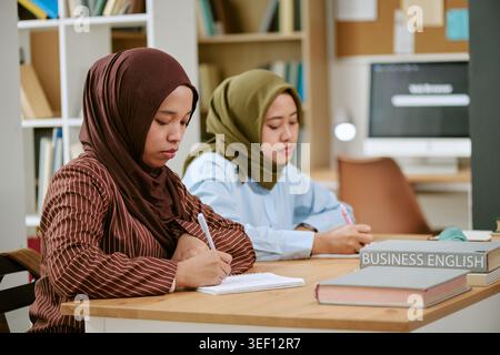 Asian Women Studying Business English for Migrant Education Stock Photo