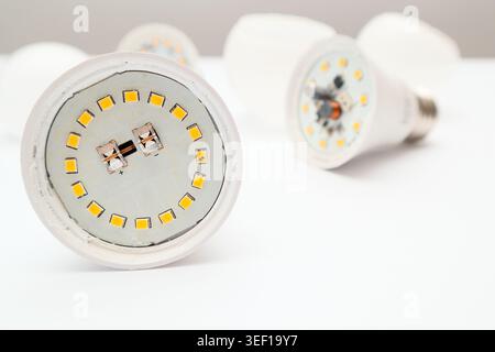 Disassembled LED lamp with one light emitting diode chip burnt out. Burnt out LED in the lamp. Stock Photo