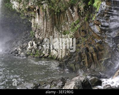 Basalt columnar jointing at Bassin la paix in La Reunion. Geological pattern and rock formation of volcanic island Stock Photo