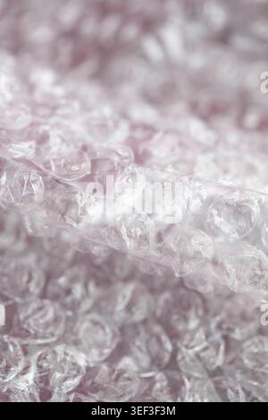 Dreamy abstract bubble wrap background with transparent plastic bubbles and soft pastel tones. Minimal modern texture with shallow depth of field and Stock Photo