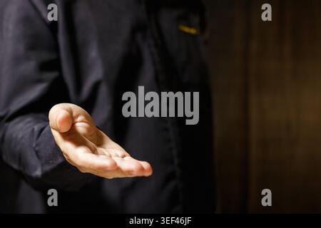 Man's open hand reaching out. Hand Gesture. Human Reaching. Business Concept. Giving and Receiving Hand Gesture. High quality photo Stock Photo