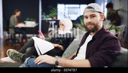 Creative, portrait or man in agency with laptop, opportunity or pride in advertisement industry. Happy, coworking or branding director with tech Stock Photo