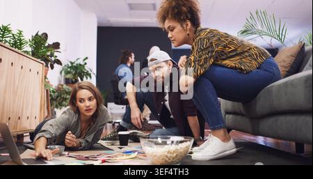 Creative, people and team planning with laptop for business project, graphic design or ideas. Group, editor or designers with computer for magazine Stock Photo
