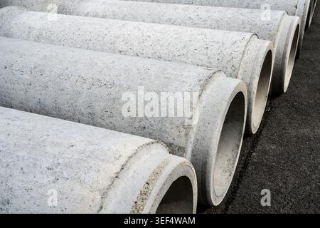 Gray concrete pipes for underground sewer construction, Germany, Europe Stock Photo