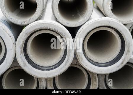 Gray concrete pipes for underground sewer construction, Germany, Europe Stock Photo