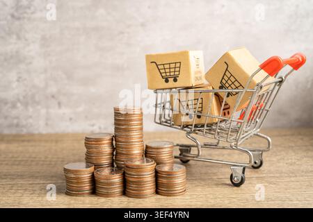 Shopping cart logo on box with stack of coins. Banking Account, Investment economy, trading, Business import export online company concept. Stock Photo