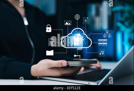 Cloud data sync and secure digital file storage concept. Person using phone and laptop with virtual cloud computing upload icon, documents, folders, Stock Photo