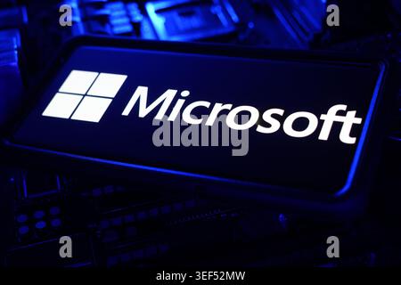 Microsoft Technology Company Logo Displayed On Digital Screen With Global Software And Cloud Computing CPU Motherboard Chips Background Stock Photo