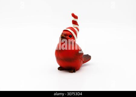 Cute Red Baby Bird with Stocking Cap Figurine on White Background. Stock Photo