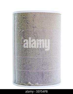 Dirty cylindrical air filter covered with dust and fine particles isolated on a white background. The clogged filter represents poor indoor air qualit Stock Photo