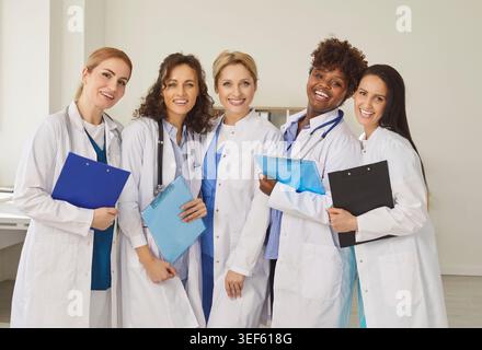 Group Portrait Of Multinational Team Of Women Doctors And Nurses In Hospital Stock Photo