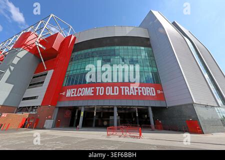 Welcome to Old Trafford sign outside Manchester United's stadium, Sir Matt Busby Way, Trafford, Greater Manchester, UK Stock Photo
