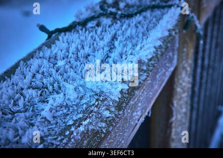 Frost Crystals on Wooden Railing in Winter Macro Texture and Ice Detail Stock Photo