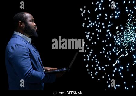 Researching AI, laptop and software developer researching algorithm clusters. Analyzing data processing, notebook and African american man studying artificial intelligence neural network visualization Stock Photo