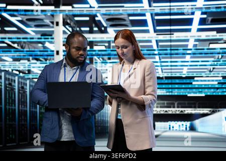 Identifying bottlenecks, devices and engineering team in data center monitoring system performance. improving efficiency, teamwork and colleagues in server farm implementing optimizations Stock Photo