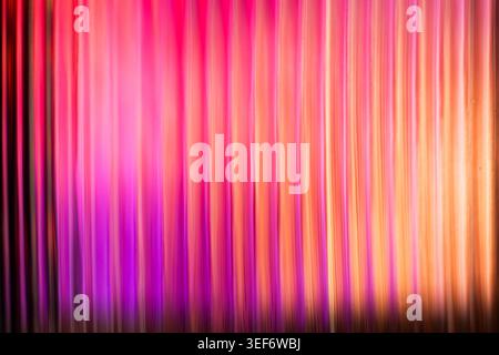 Vibrant pink and orange magenta gradient light lines through glass Stock Photo