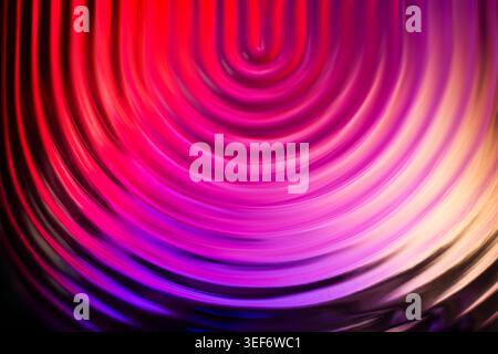 Bright pink and purple concentric circular light ripples and reflections Stock Photo