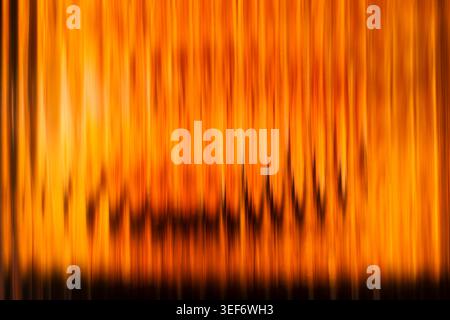 Intense orange and yellow vertical ribbed glass light texture Stock Photo