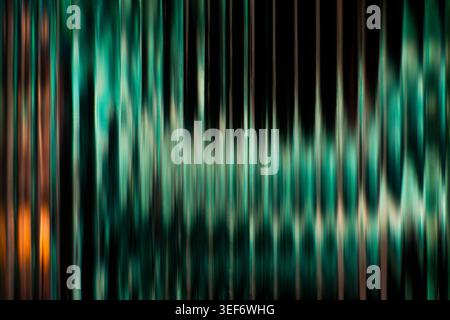 Elegant dark teal and green vertical blurred stripes with a luminous ribbed glass effect Stock Photo