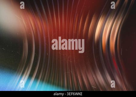 Abstract dark vintage background with glowing curved lines and film dust texture Stock Photo