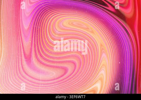 Psychedelic pink and magenta swirling liquid lines with vintage dusty texture Stock Photo