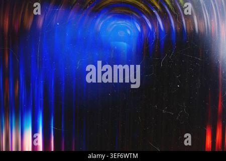 Deep blue and neon cyan vertical glowing light bands on a dark grunge scratched surface Stock Photo