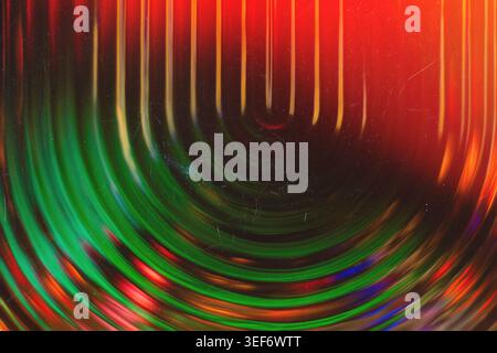 Retro futuristic background with glowing green and red concentric light trails and vintage textures Stock Photo