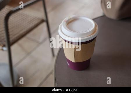 Warm drink sits on table in a cozy cafe setting Stock Photo