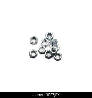 Zinc Plated Hex Nuts Group Isolated on White Background, Silver Metal Hexagonal Fasteners Macro View Stock Photo