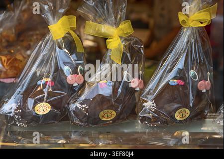 Chocolate Easter bunnies wrapped in cellophane in a pastry shop, Linz, Austria Stock Photo