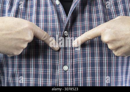 A man pointing at himself with his fingers Stock Photo