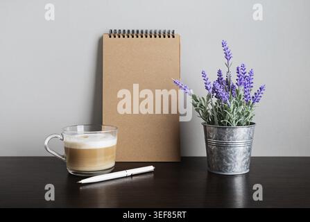 Photo of blank notepad, pen, cappuccino and artificial lavender Stock Photo