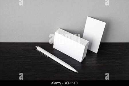 Blank business cards and white pen. Template for branding ID Stock Photo