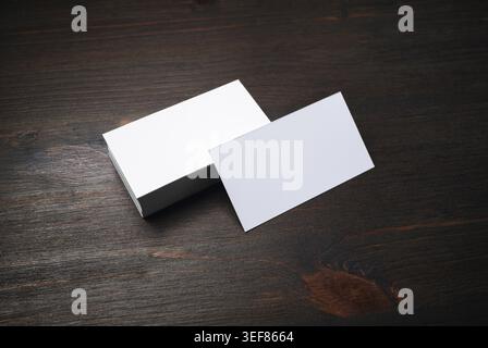 Blank white business cards on wooden background. Mockup for ID. Template for graphic designers portfolios Stock Photo