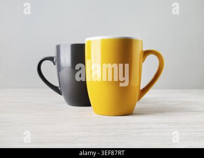 Two blank tea cups or coffee mugs. Responsive design mockup. Selective focus Stock Photo