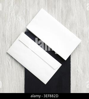Two blank envelopes. Front and back side. Template for branding identity. Top view. Flat lay Stock Photo