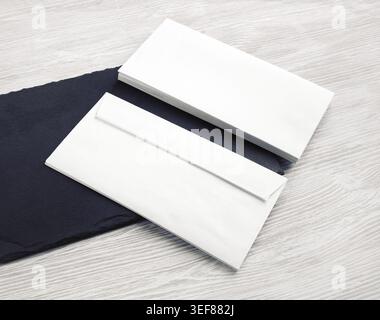 Photo of two blank white envelopes. Front and back side. Template for branding identity Stock Photo