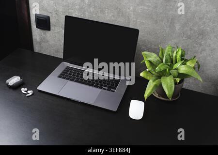 Office gadgets and laptop with blank screen Stock Photo