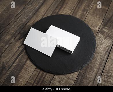 Photo of blank white business cards and round slate plate on wooden surface. Copy space Stock Photo