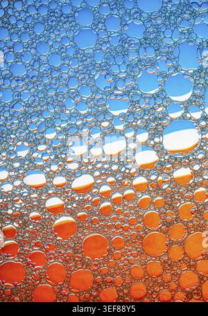 Blue and orange bubbles background. Foam bubbles macro texture Stock Photo
